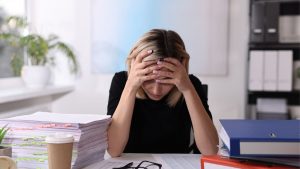 Image of female business owner feeling overwhelmed